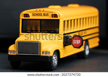 School bus model with stop sign. Do not pass the school bus. The stop signal arm.