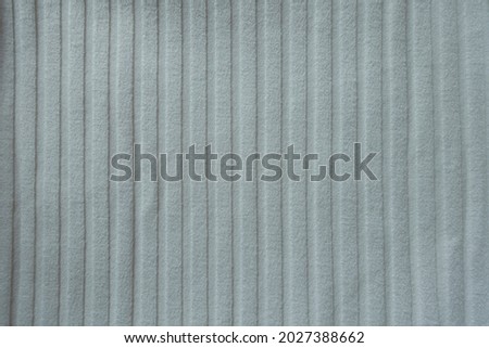 Texture of simple white ribbed cotton fabric from above