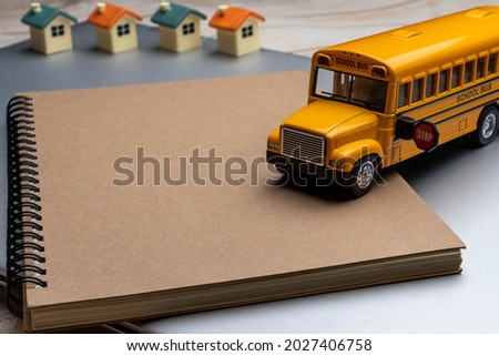 School bus on the Book. Composition school bus model and Note book, Draw and write. Back to School Concept.