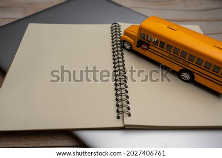 School bus on the Book. Composition school bus model and Note book, Draw and write. Back to School Concept.