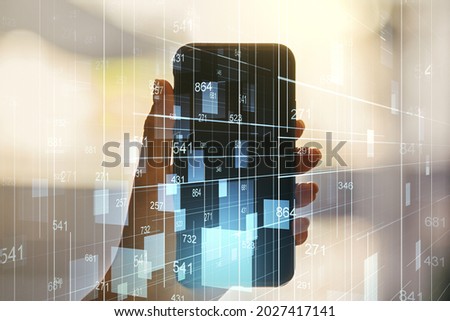 Multi exposure of abstract graphic data spreadsheet sketch and hand with mobile phone on background, analytics and analysis concept