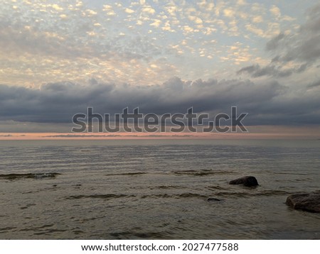 gently blue-pink gradient of the horizon of the sea and sky during sunset