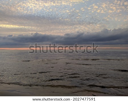 gently blue-pink gradient of the horizon of the sea and sky during sunset