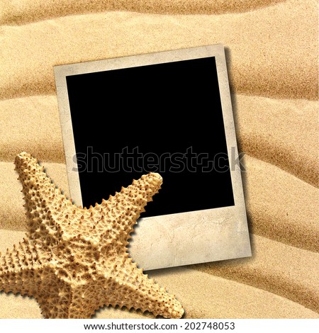 Photo of an old style decorated starfish on a background of sea sand