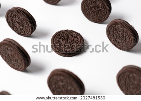 This is a photo of delicious chocolate biscuits with a pattern concept and photographed on a white background