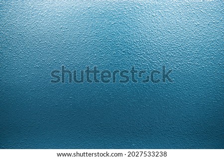 Painted textured surface in blue. Free space for text and title for design and graphic design