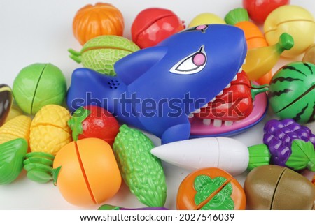 Blue plastic shark eating fruit and Vegetable toys. Fruit and Vegetable toys for kid.
