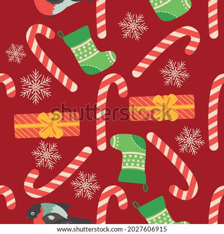 Christmas seamless pattern with candy cane, gift, stocking, bullfinch bird. Christmas wrapping paper.