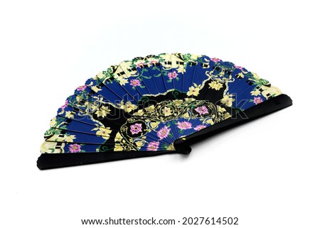 Blue fan with floral motifs on white background