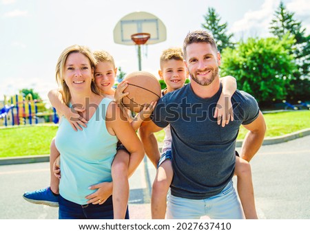 A Happy basketball family portrait play this sport on summer season
