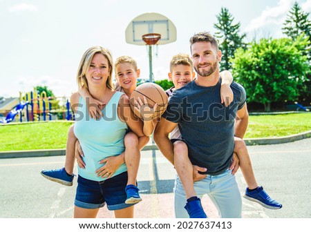 A Happy basketball family portrait play this sport on summer season