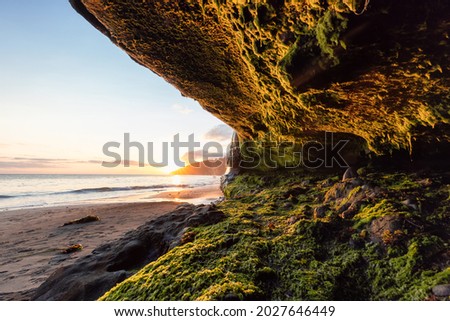Cave on Mystic Beach on the West Coast of Pacific Ocean. Summer Sunny Sunset. Canadian Nature Landscape Background. Located near Victoria, Vancouver Island, British Columbia, Canada.