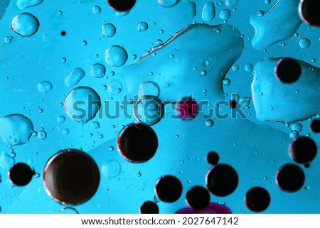 oil bubbles on glass and colored background