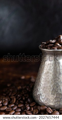 Turkish Jezve Coffee Pot with hot coffee at coffee beans background hd