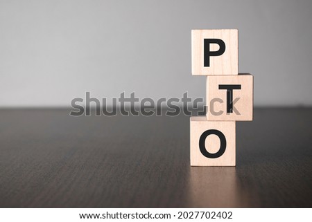 Businesswoman made word pto with wood building blocks. Royalty-Free Stock Photo #2027702402
