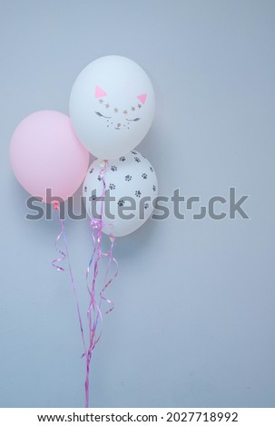 balloons with the image of a cat's face