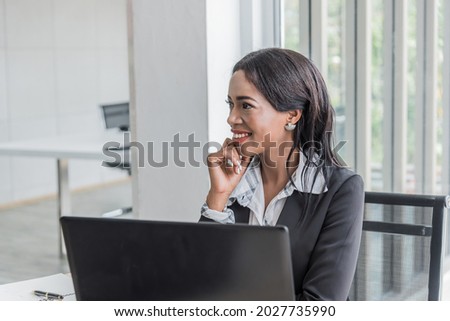 African business woman working in office using computer and think planning marketing.