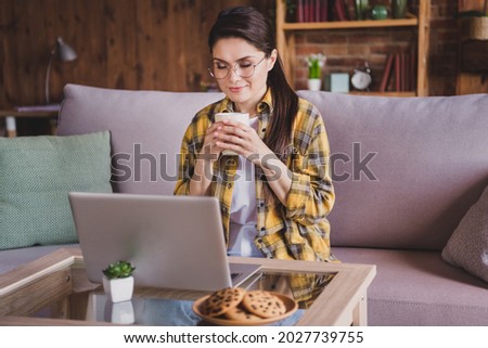 Photo of young relaxed calm peaceful happy woman hold hands mug coffee smell work remote indoors inside house home