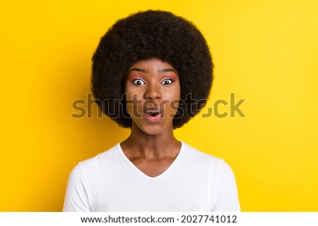 Photo of charming nice dark skin amazed woman sale news reaction impressed isolated on yellow color background