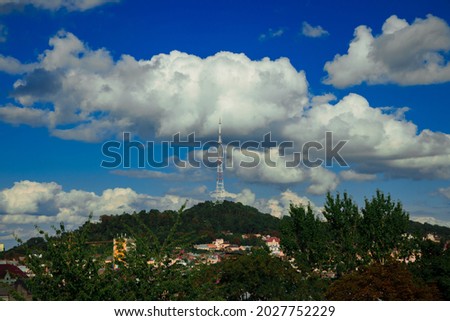 TV tower city scape soft focus photography summer outdoor landscape green hill and cloudy blue sky backgrounds, soft focus concept 