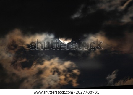Thick clouds that cover the full moon