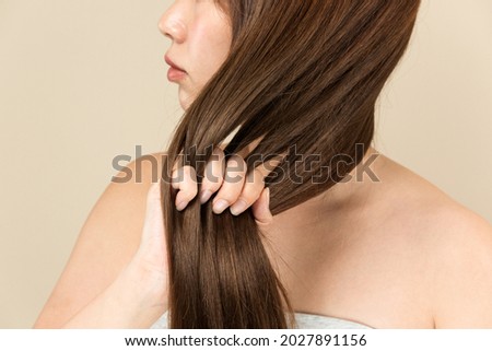 The woman is checking her armpit sweat. Royalty-Free Stock Photo #2027891156
