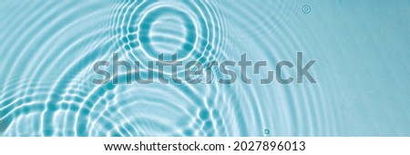 Water texture, surface with rings, ripples. Spa concept background Banner Royalty-Free Stock Photo #2027896013