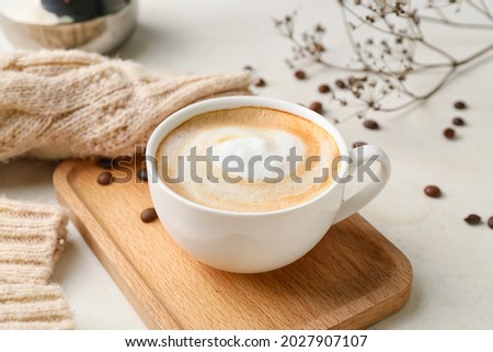 Cup of hot cappuccino coffee on table Royalty-Free Stock Photo #2027907107