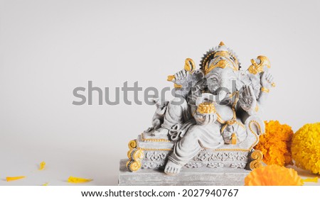 Happy Ganesh Chaturthi festival, Lord Ganesha statue with beautiful texture on white background, Ganesh is hindu god of Success. Royalty-Free Stock Photo #2027940767