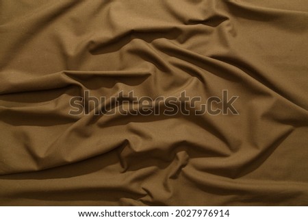 crumpled khaki tan crumpled tan khaki canvas fabric - full frame background and texture
