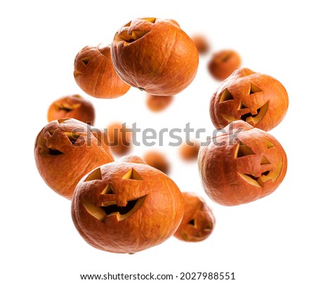 Glowing pumpkins levitate on a white background