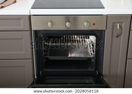 Open oven in modern kitchen