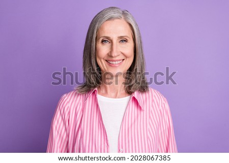 Photo of aged woman happy positive smile toothy ceramic stomatology isolated over violet color background