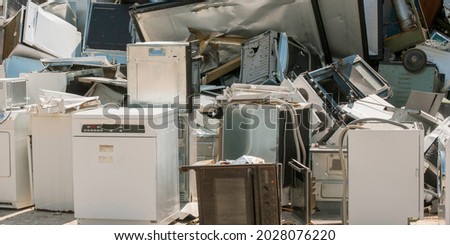 Old household appliances for destruction, recycling. Royalty-Free Stock Photo #2028076220