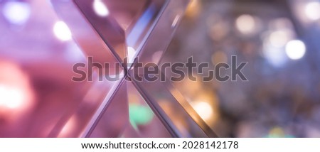 Abstract blurry mirror background, bokeh, pink, purple. Trendy Fashionabel background. Mirror texture. Concept letter X