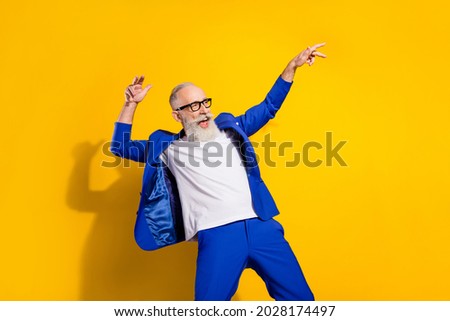 Photo portrait of funky cool businessman relaxing chilling dancing at party looking copyspace isolated bright yellow color background Royalty-Free Stock Photo #2028174497