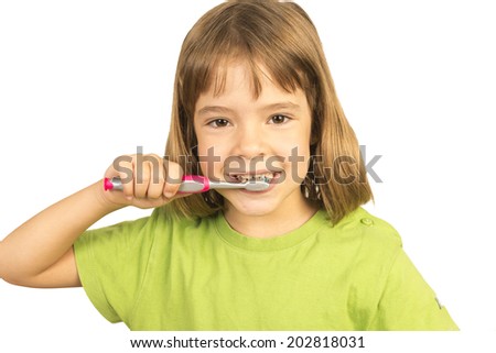 Portrait of a little girl brushing his teeth 