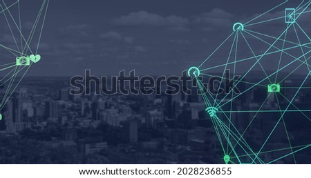 Digital image of green glowing globe of digital icons against clouds over cityscape. Global finances and business concept