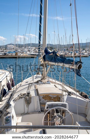 Moored nautical vessels at sea port San Antonio de Portmany, Balearic Islands, Ibiza, Spain. Sunny spring day.