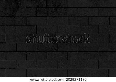 Old black stone brick wall texture for background