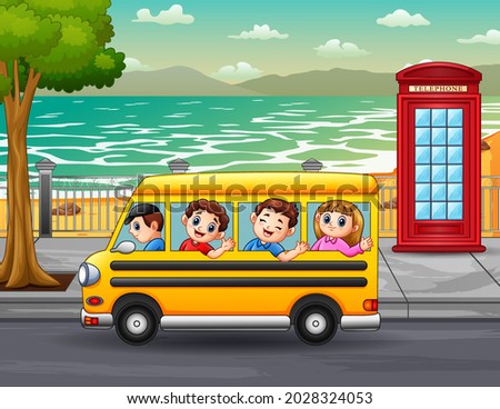 Children ride the bus through the city streets