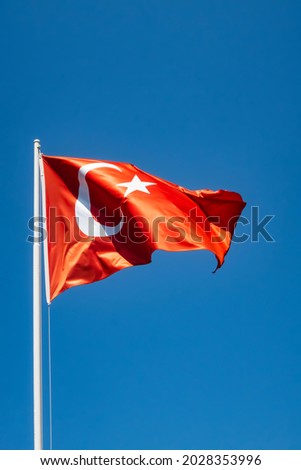blue sky and waving turkish flag
