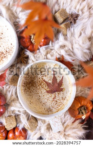 Autumn still life with a cup of coffee and autumn leaves