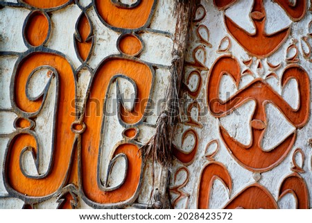 The photo shows the patterns and motifs of the Asmat Tribe carvings in an abstract style. This photo is perfect for art backgrounds, gallery and vintage designs that are in vogue right now Royalty-Free Stock Photo #2028423572