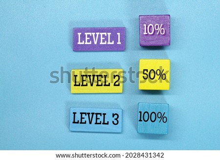 colored cubes with the words level 1, level 2 and level 3 Royalty-Free Stock Photo #2028431342