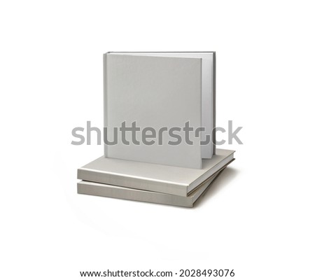 Grey isolated three opened and closed square books two laid and one on top partially opened book, brochure, book or notebook template on White background