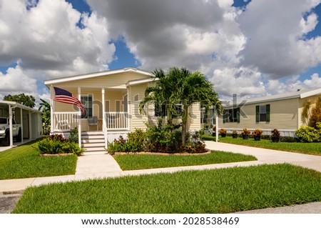 Mobile home with American pride flag Royalty-Free Stock Photo #2028538469