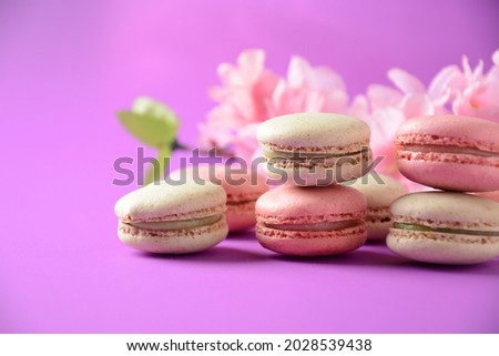Colorful macarons cakes. Small French cakes. Sweet and colorful french macaroons, colorful almond cookies, pastel colors