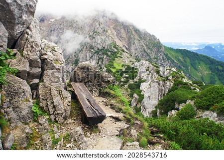          old wooden bench in the alp mountains                     