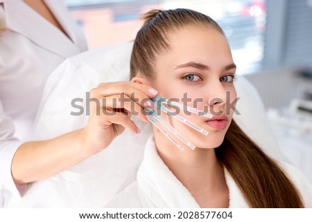 procedure for face lifting PDO Suture operation, face lifting surgery. innovative technique of New thread lift, cropped cosmetologist preparing to do procedure, select the appropriate thread option Royalty-Free Stock Photo #2028577604